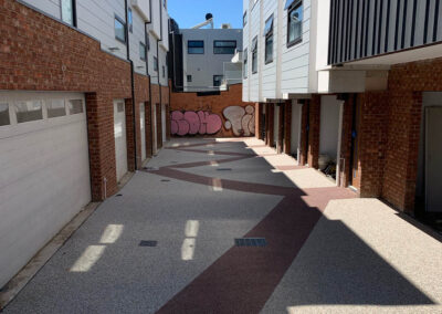 Modern permeable concrete courtyard in a residential complex.